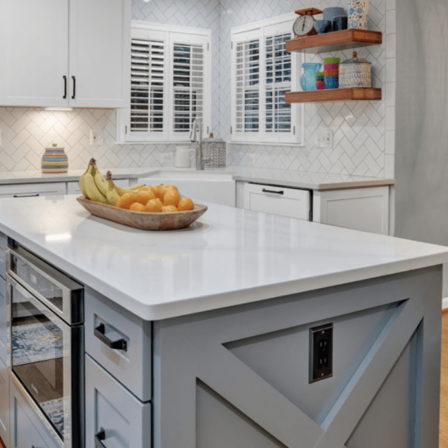 An island adds extra kitchen counter space to an L-shaped kitchen